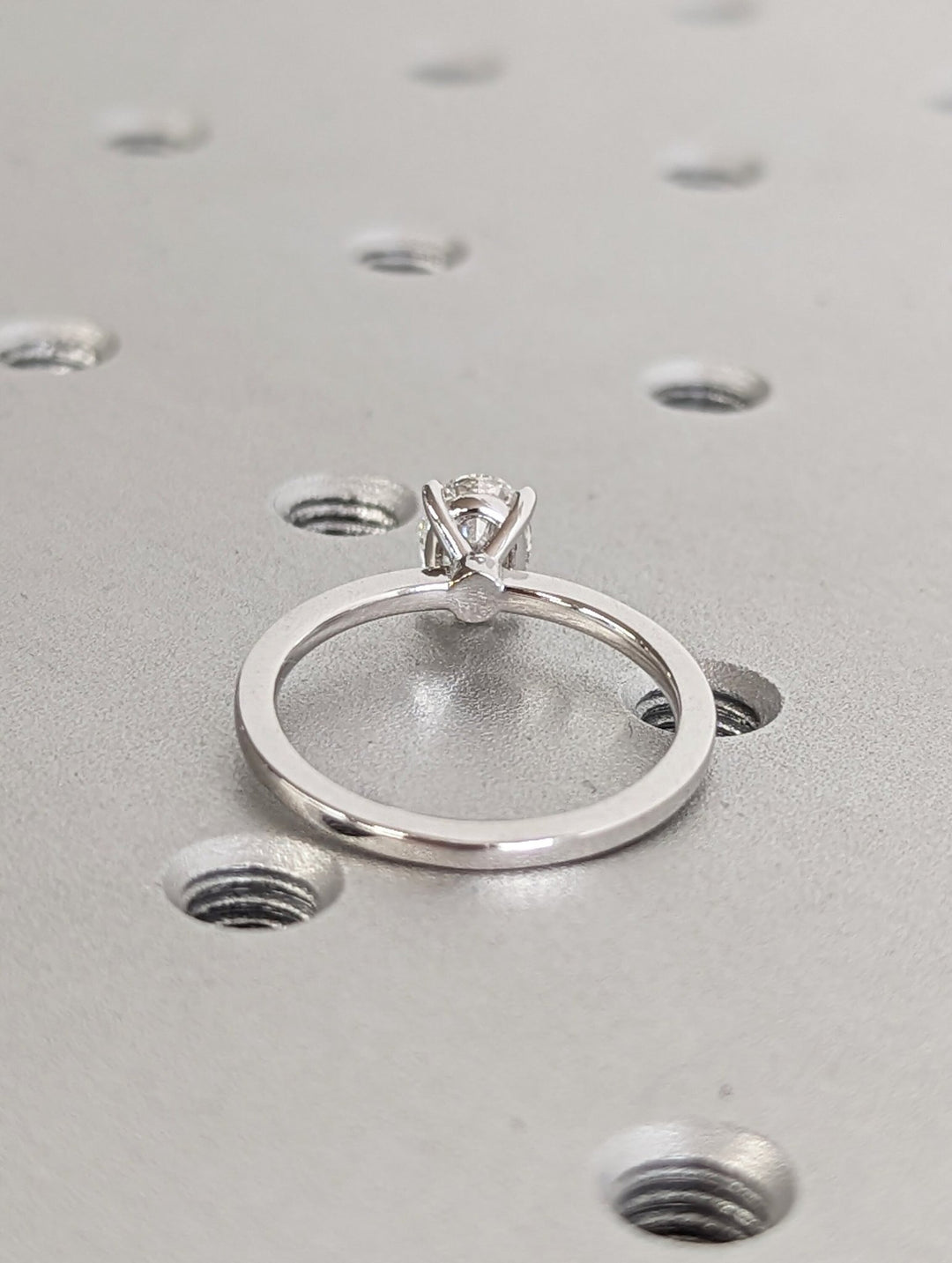 Oval solitaire engagement ring close-up showing high clarity diamond clarity