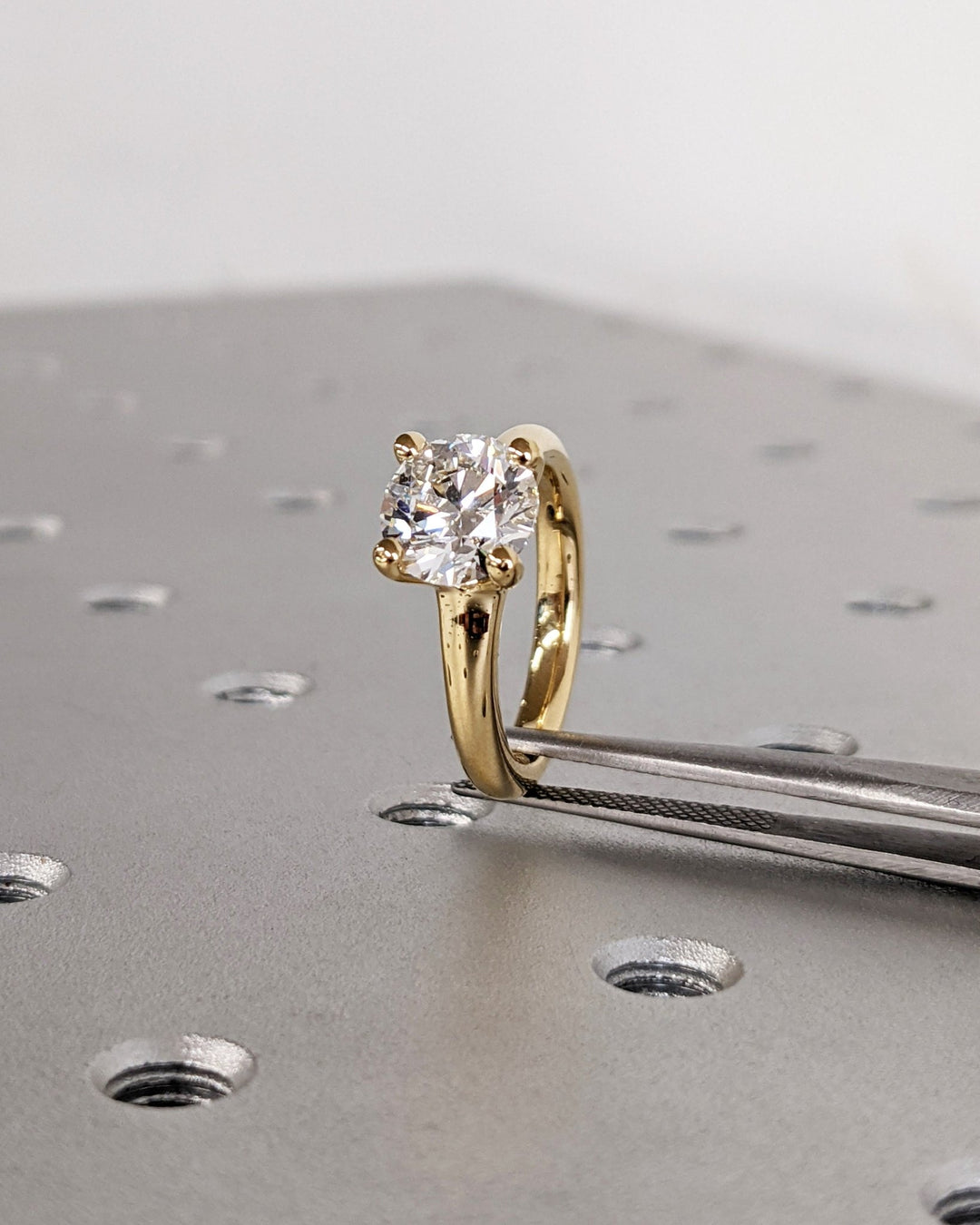 Round cut engagement ring side view showing band detail