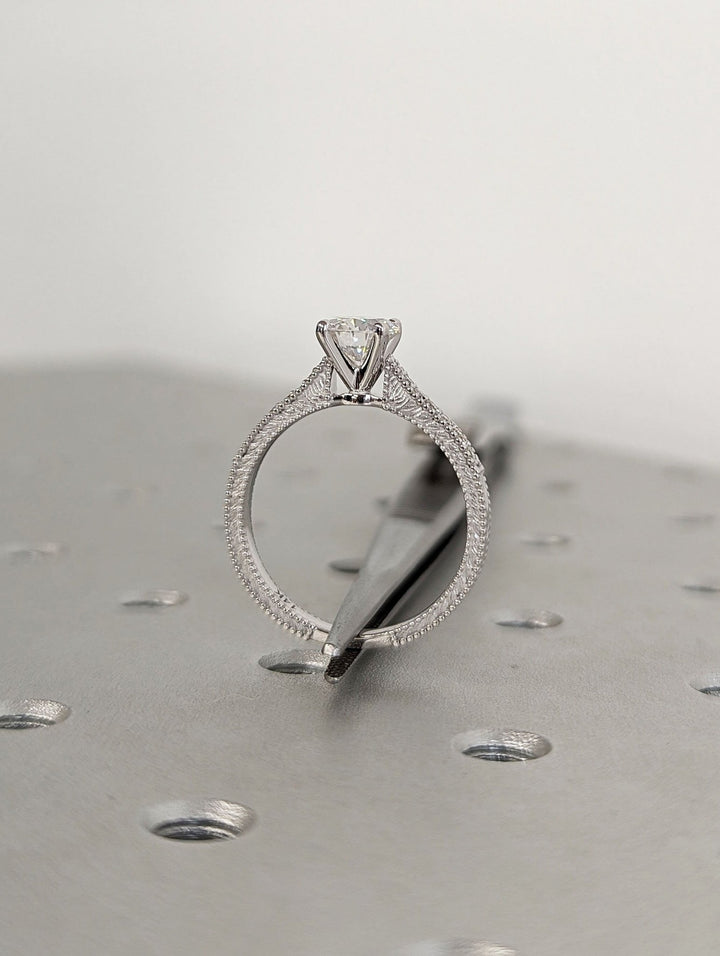 Round vintage diamond ring presented in signature gift packaging