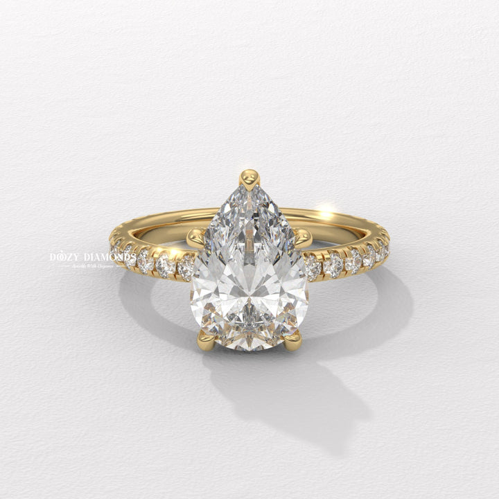 Pear cut hidden halo engagement ring available to buy now