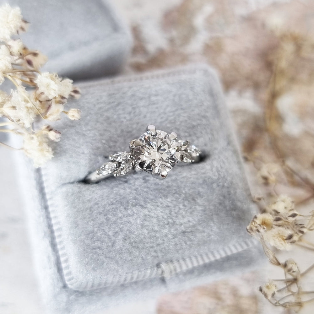 Shop the round cut cluster engagement ring collection online