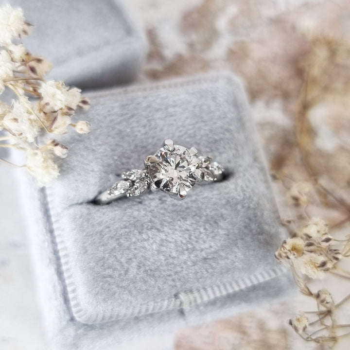 Shop the round cut cluster engagement ring collection online