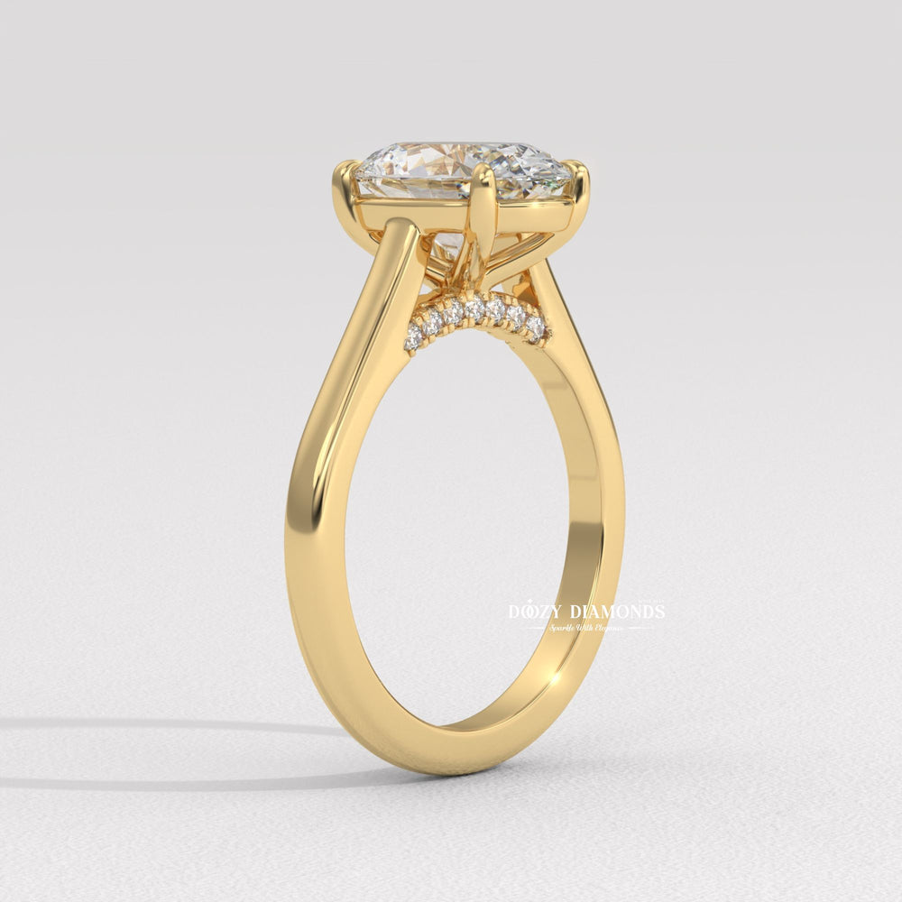 Oval solitaire engagement ring photographed in natural light