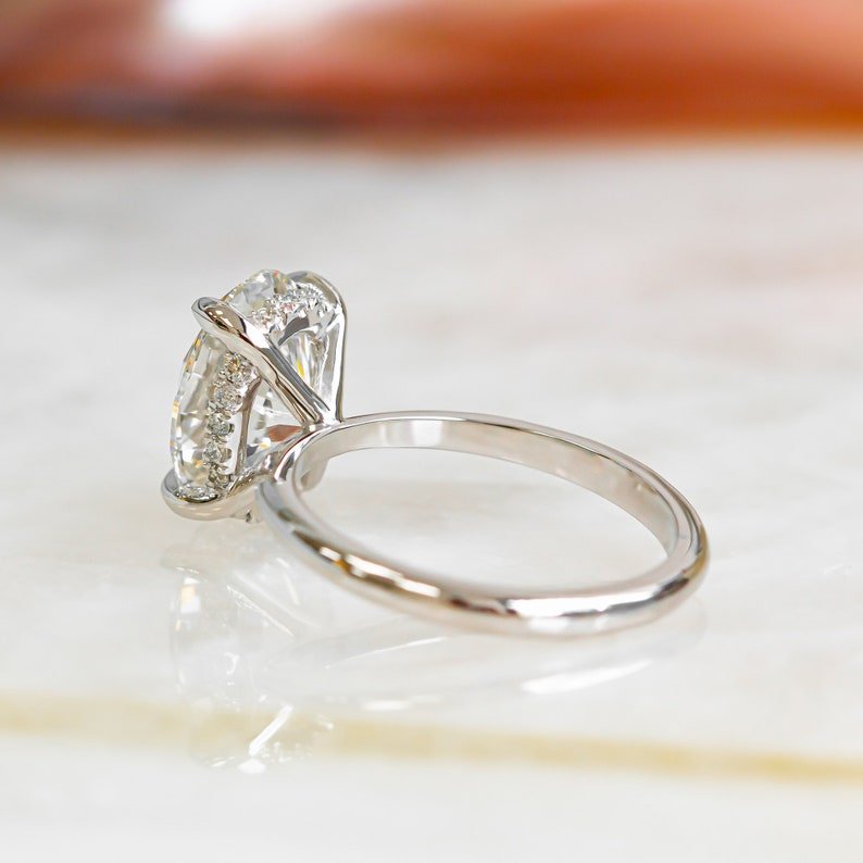 Handcrafted oval cut hidden halo lab grown diamond engagement ring