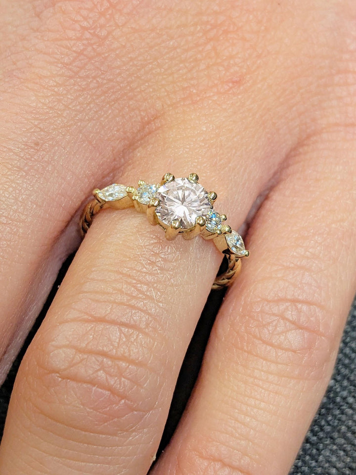 Top-down view of round cut cluster engagement ring