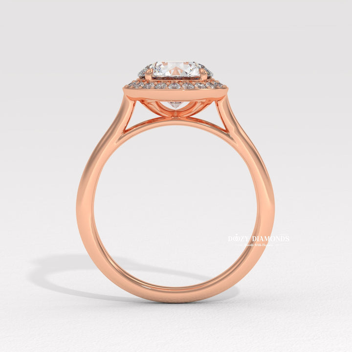 Round halo engagement ring photographed in natural light