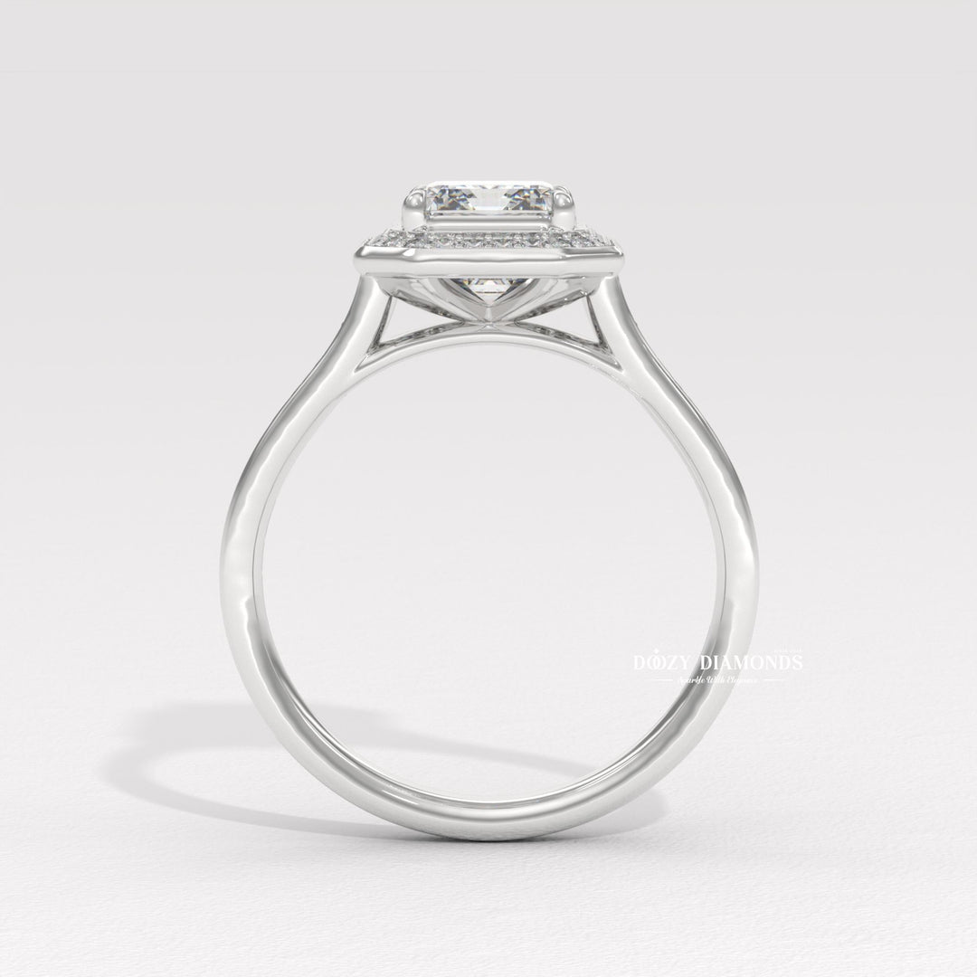 Profile view of emerald cut halo engagement ring band