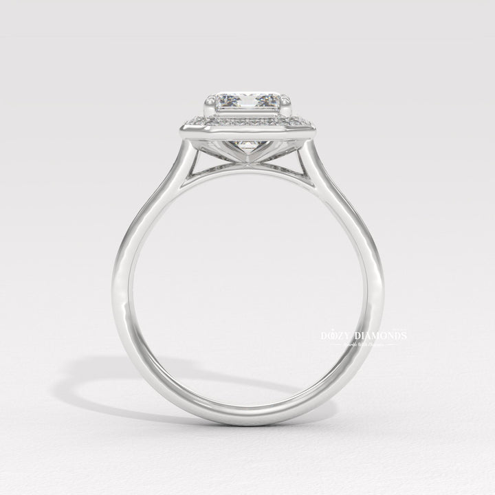 Profile view of emerald cut halo engagement ring band