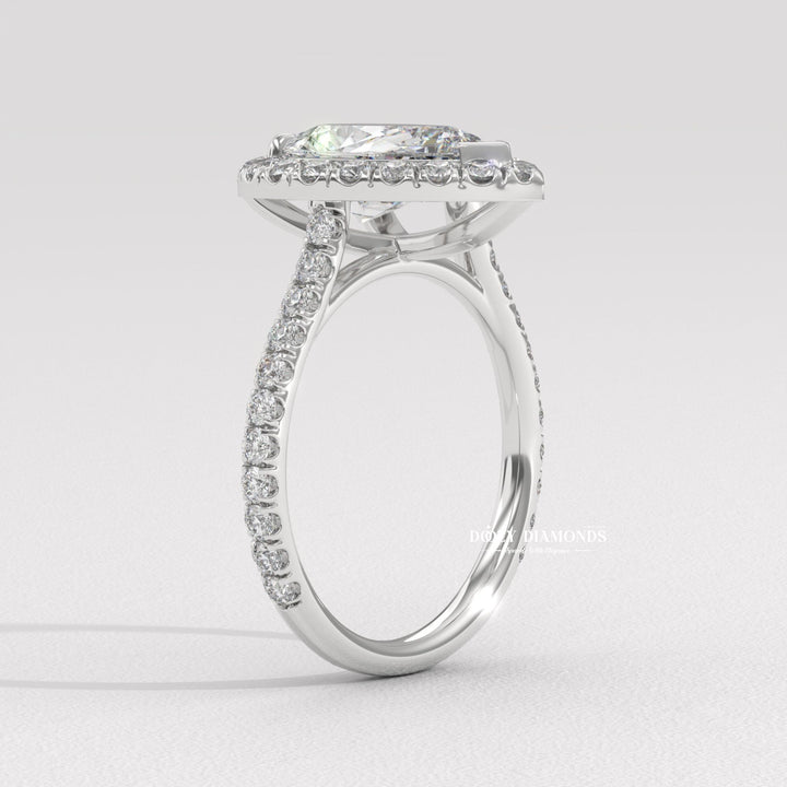 Side angle of pear halo diamond engagement ring