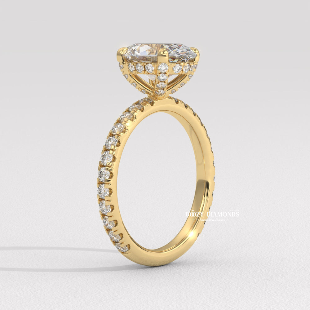 Macro shot of oval cut diamond facets in hidden halo ring setting