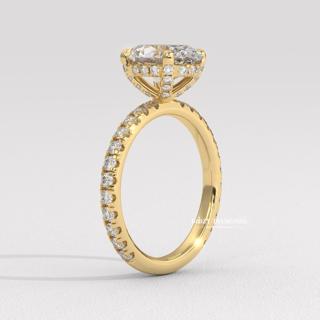 Macro shot of oval cut diamond facets in hidden halo ring setting