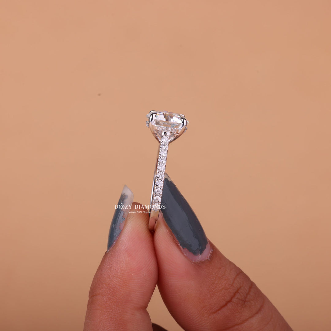 Round cut hidden halo engagement ring shown in real-life wear