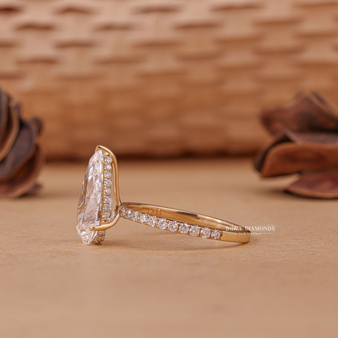 Pear cut hidden halo engagement ring shown in real-life wear