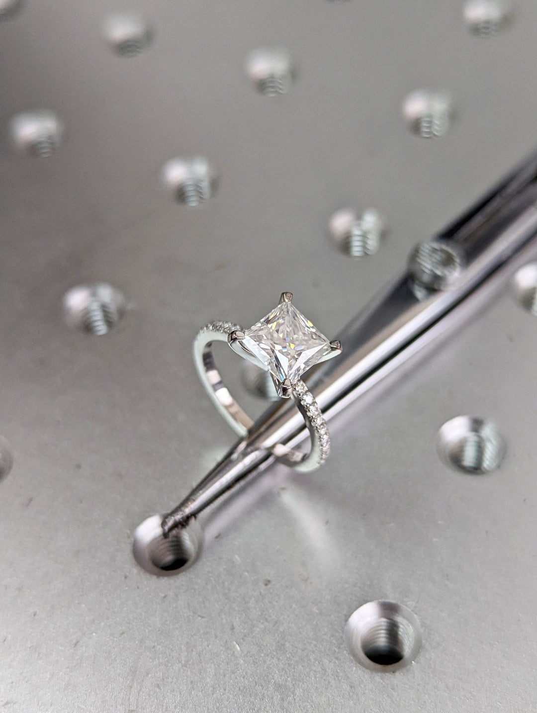 Princess pave engagement ring shown on hand for true-to-life sizing