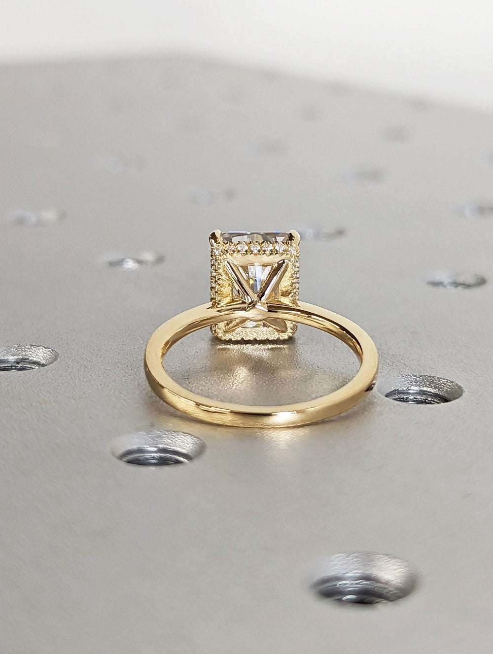 Radiant cut engagement ring shown with authenticity certificate