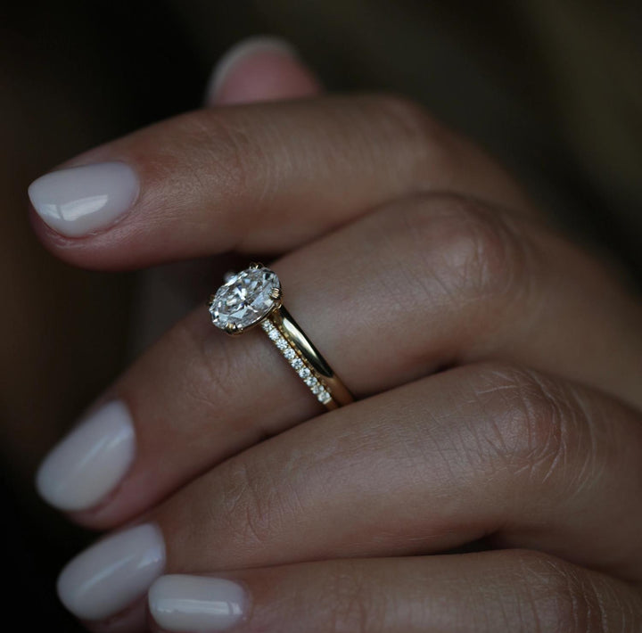 Certified oval cut diamond featured in solitaire engagement ring