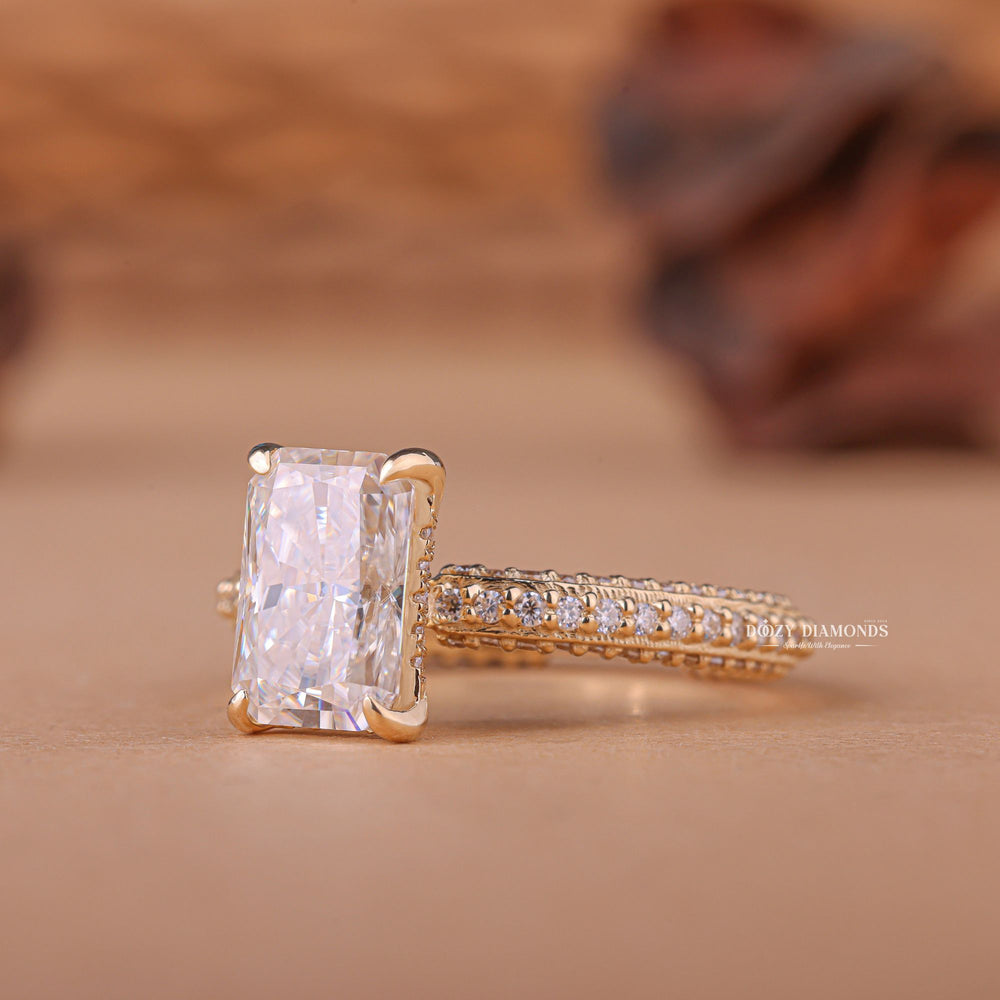 Close-up of radiant cut center diamond in pave engagement ring