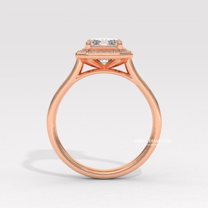 Emerald cut halo engagement ring shown in real-life wear