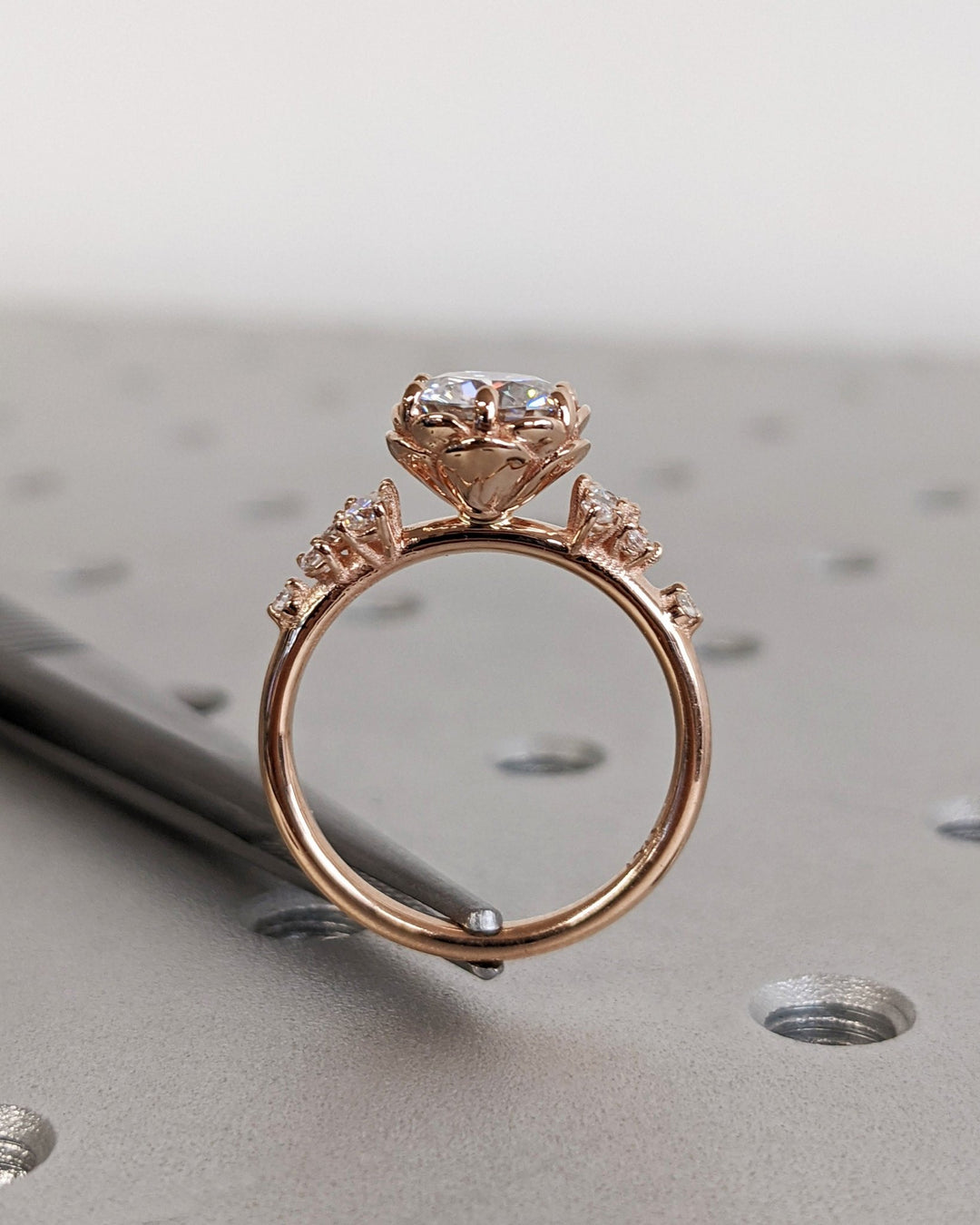 Round cut engagement ring side view showing band detail