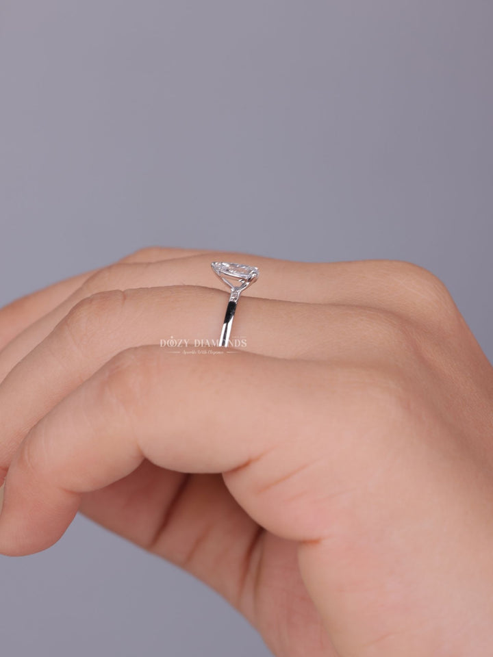 Pear solitaire engagement ring viewed from the side