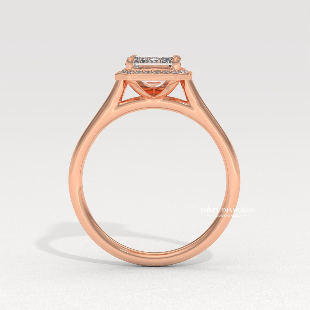 Emerald cut engagement ring shown with authenticity certificate