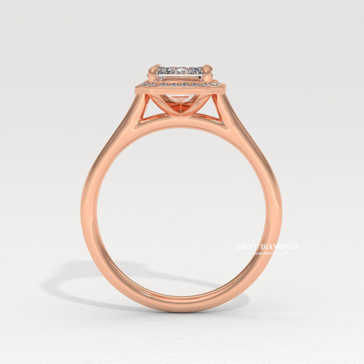Emerald cut engagement ring shown with authenticity certificate