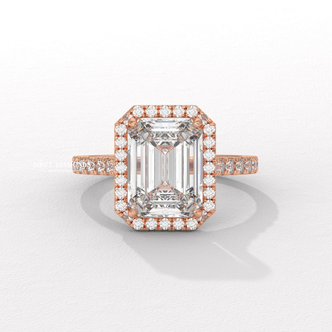 Emerald pave ring set with an IGI graded diamond