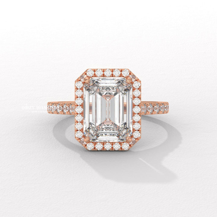 Emerald pave ring set with an IGI graded diamond