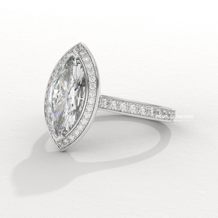 Marquise halo diamond ring displayed on jewelry stand