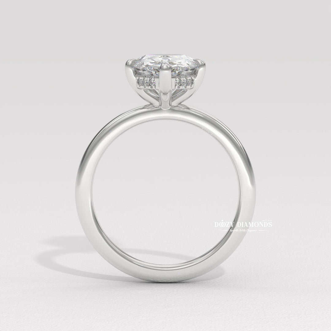 Fine craftsmanship detail on pear hidden halo engagement ring