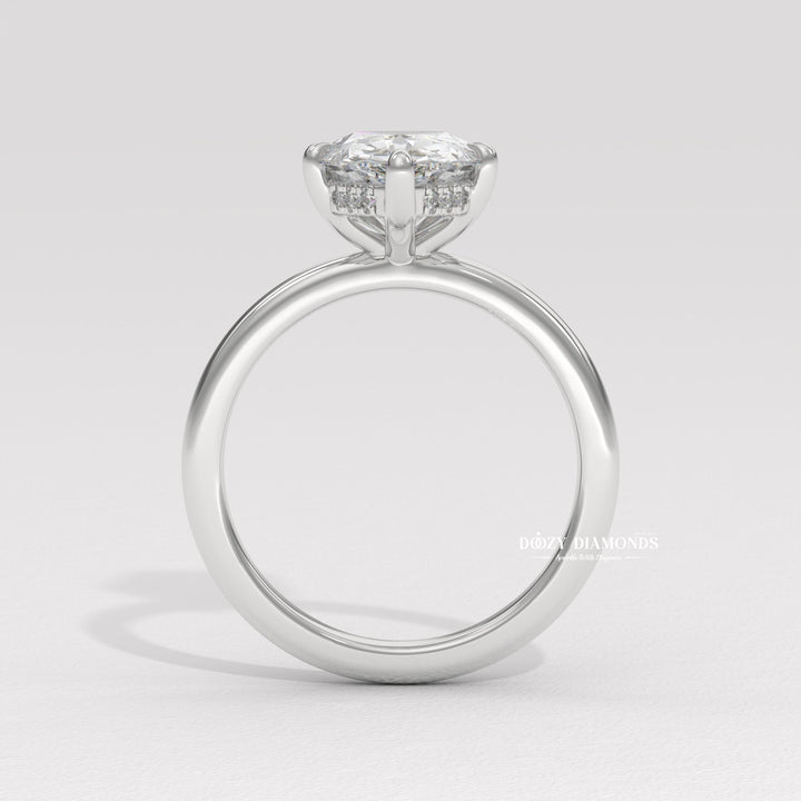Fine craftsmanship detail on pear hidden halo engagement ring