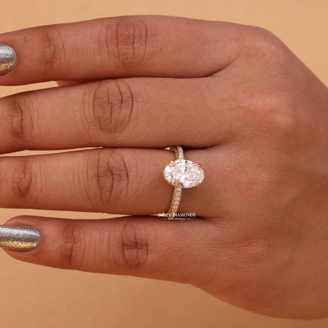 Oval cut hidden halo engagement ring shown in real-life wear
