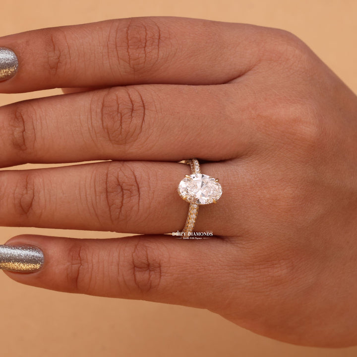 Oval cut hidden halo engagement ring shown in real-life wear