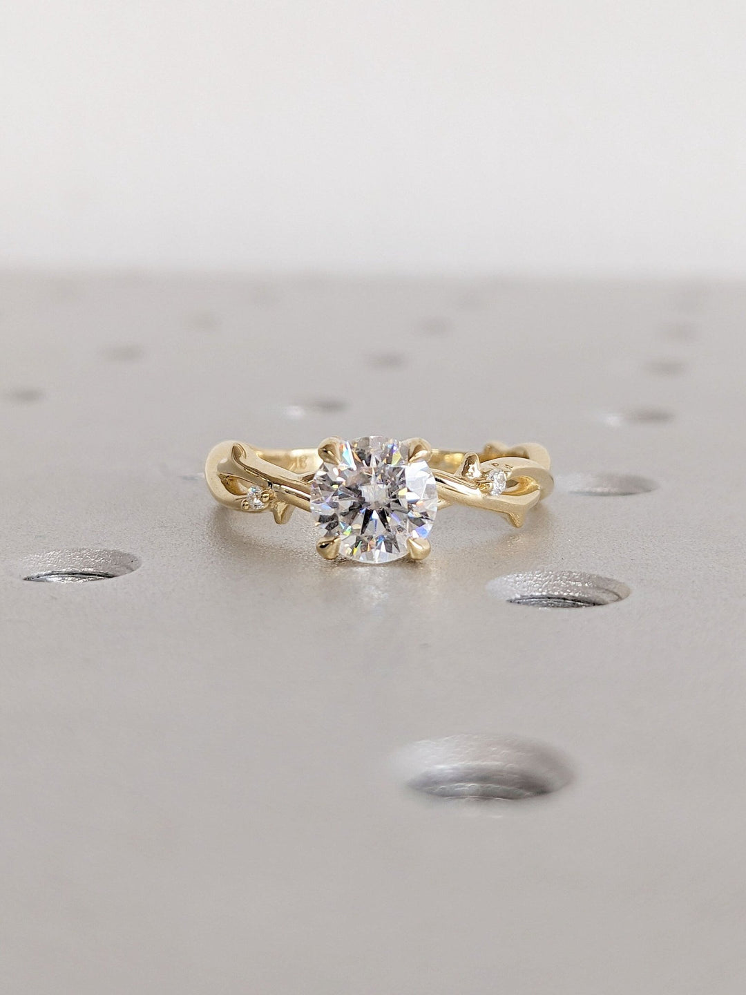 Round solitaire engagement ring offered in gold and platinum