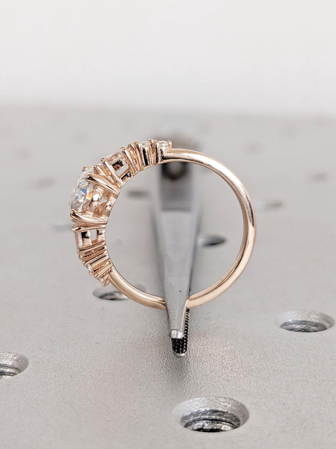 Oval cluster engagement ring close-up showing high clarity diamond clarity