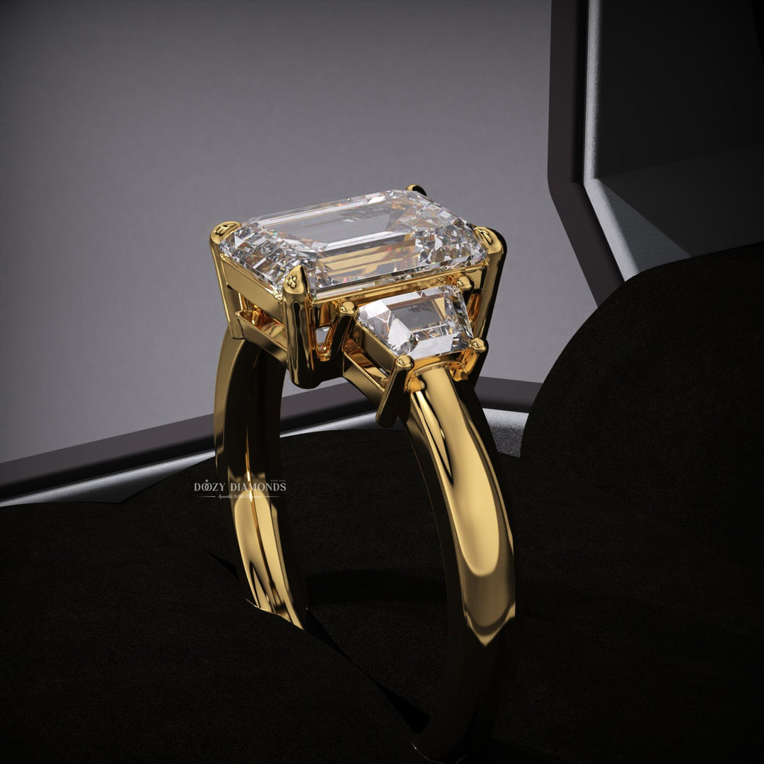 Emerald three stone lab grown diamond ring fitted on finger