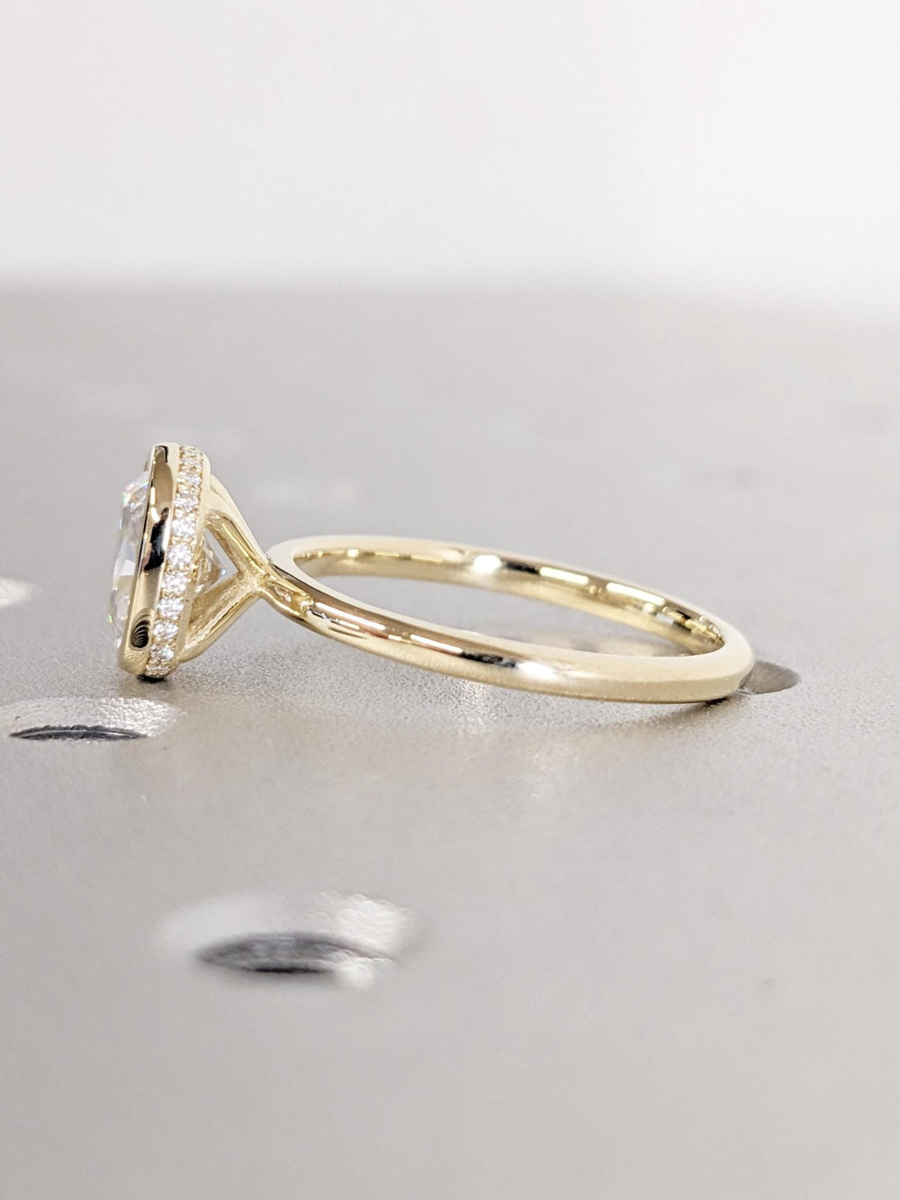Cushion hidden halo engagement ring with brilliant diamond sparkle
