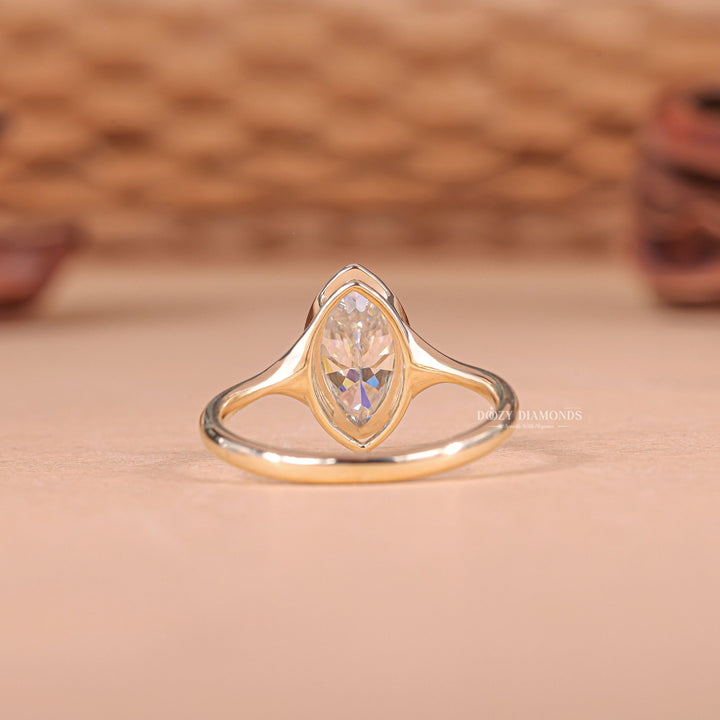 Premium marquise cut bezel engagement ring crafted in solid gold
