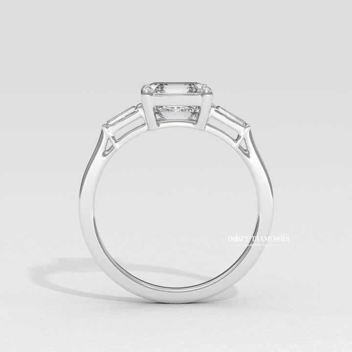 Profile view of asscher cut three stone engagement ring band