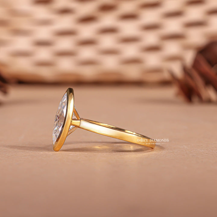 Marquise cut bezel engagement ring shown in real-life wear