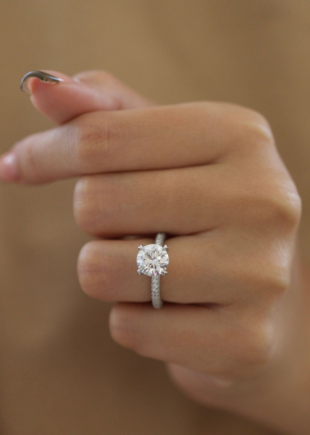 Round cut pave engagement ring with IGI certified center diamond