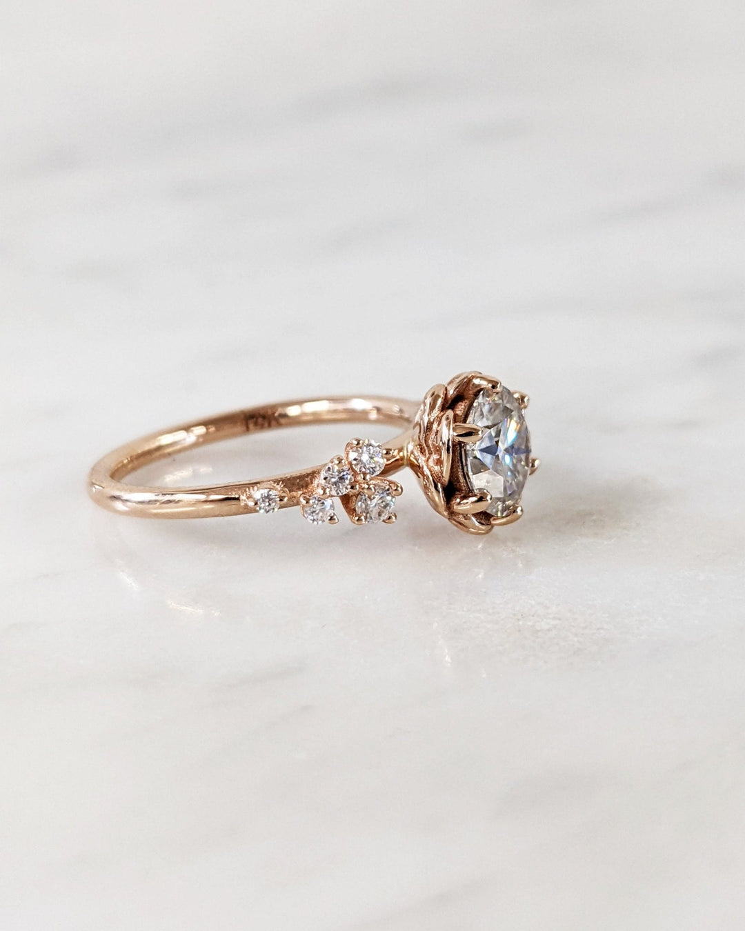 Side angle of round cluster diamond engagement ring
