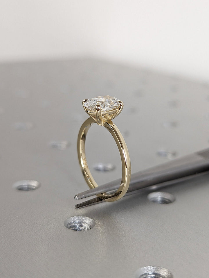 Certified oval cut diamond featured in solitaire engagement ring
