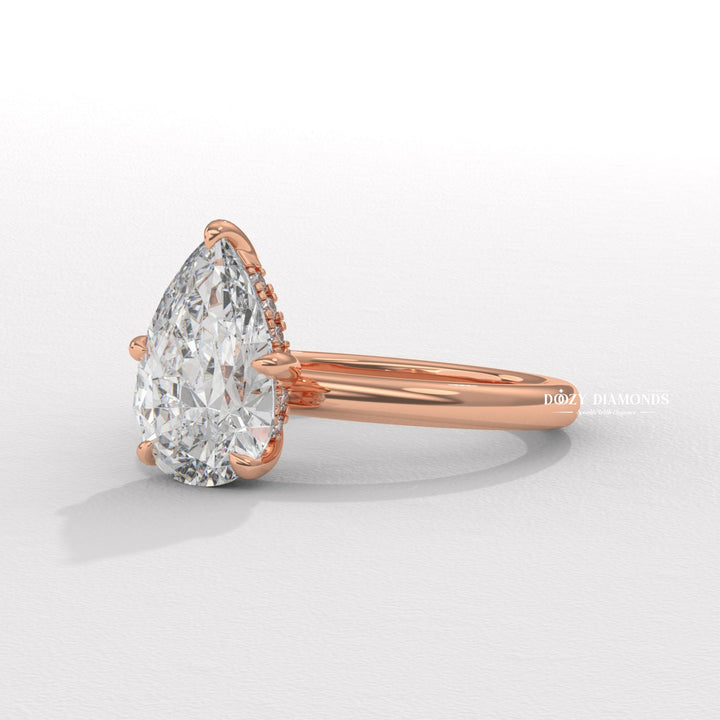 Premium pear cut hidden halo engagement ring crafted in solid gold