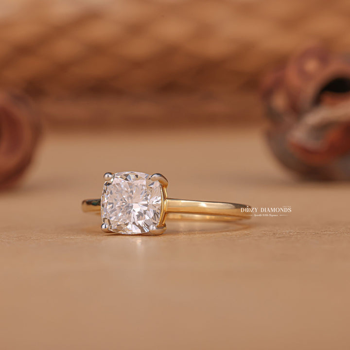 Cushion cut engagement ring shown with authenticity certificate