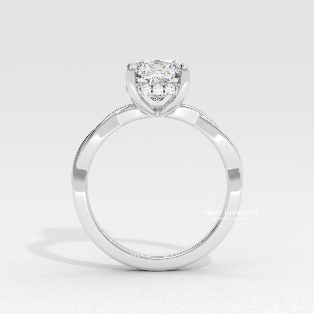 Cushion cut solitaire engagement ring shown in real-life wear