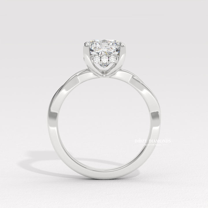 Cushion cut solitaire engagement ring shown in real-life wear
