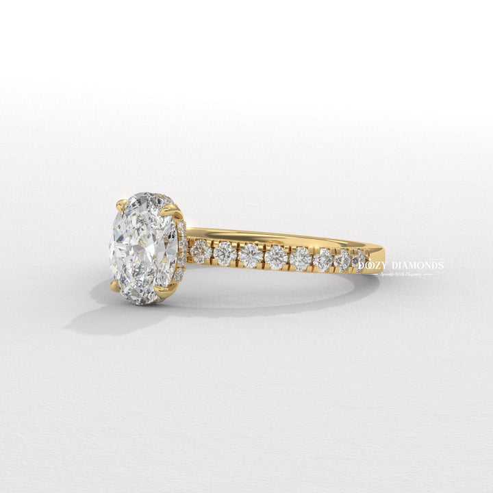 Fine craftsmanship detail on oval hidden halo engagement ring