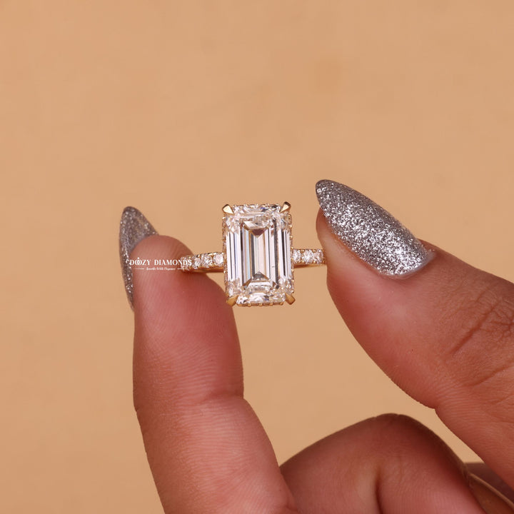Emerald cut engagement ring side view showing band detail