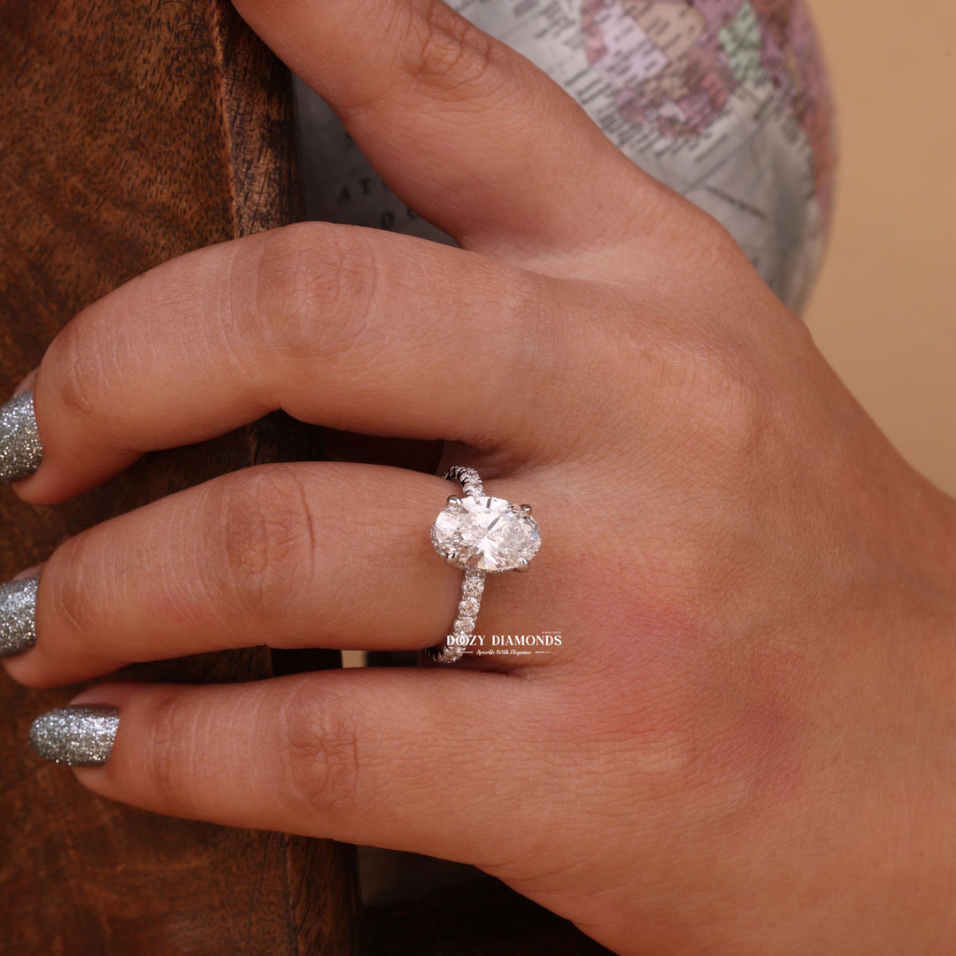 Oval hidden halo engagement ring close-up showing high clarity diamond clarity